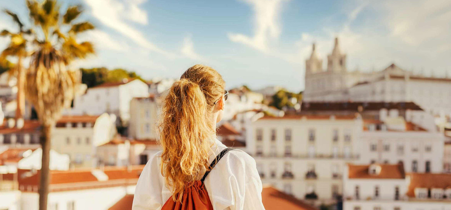 A young women admiring the urban landscape from Lisbon