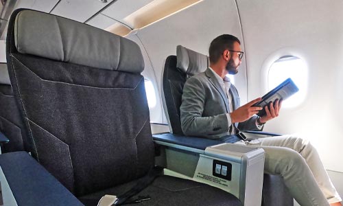 Passenger seated on comfort class seat